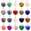 Collection of heart-shaped gemstone pendants in various colors on a white background