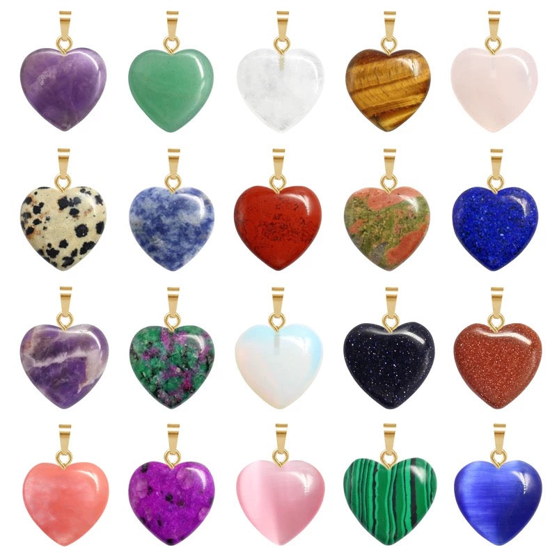 Collection of heart-shaped gemstone pendants in various colors on a white background