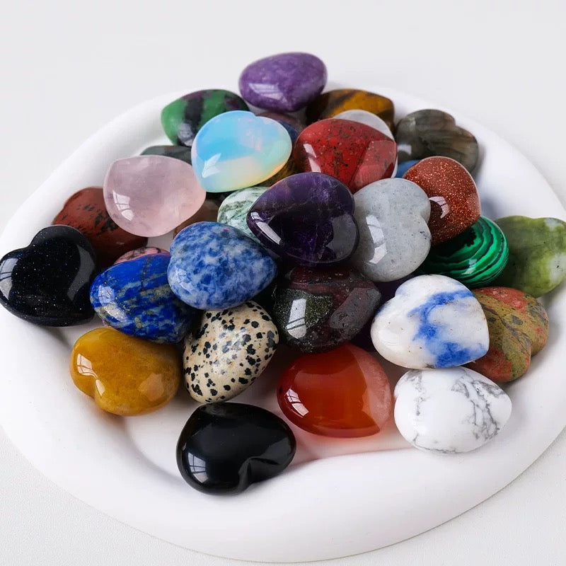 Assorted colorful gemstones on a white plate