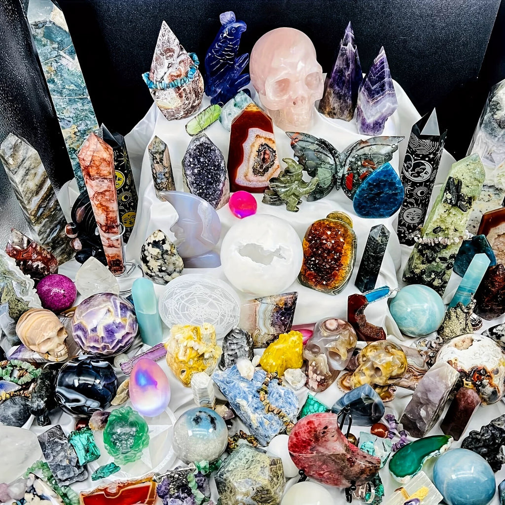 Collection of various crystals and gemstones on a white surface